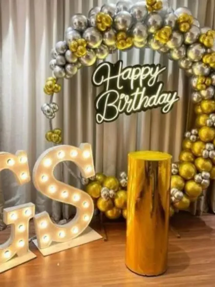 For a truly special birthday, I offer these premium setups. This one includes a full ring of metallic gold and silver balloons, a bright "Happy Birthday" neon sign, and large, light-up marquee letters for the initials. It's a glamorous photo backdrop perfect for milestone birthdays.