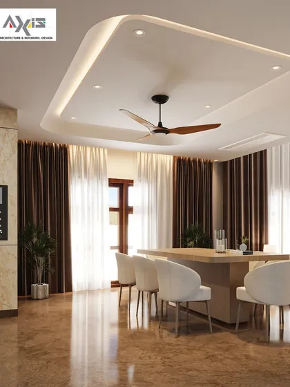 A dining hall designed to be a soulful sanctuary for conversations. The recessed ceiling with cove lighting adds a sense of height and drama, while the simple wooden table and upholstered chairs keep the focus on togetherness.