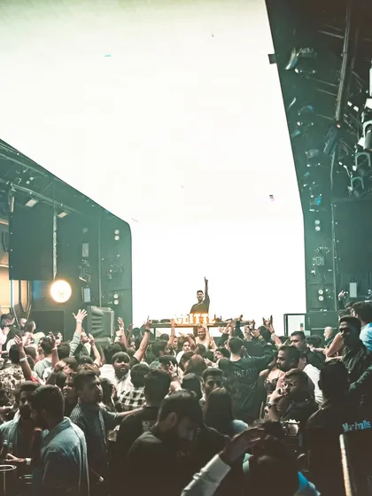 Another perspective of the massive crowd at Glitte, with the giant LED screen creating a bright, high-contrast backdrop.