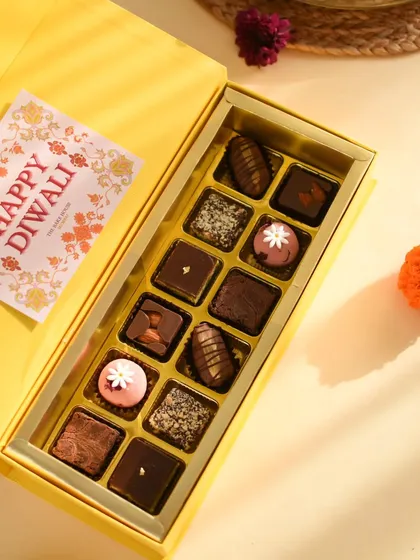 The Fusion Treat Box, elegantly packaged for Diwali gifting. It's a thoughtful way to share a variety of unique, handcrafted sweets with friends and family.