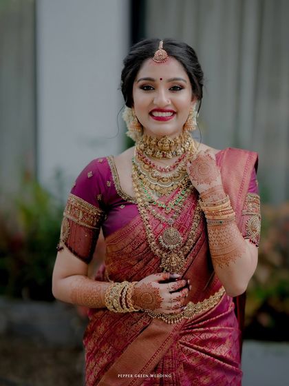Another beautiful portrait of the bride, her happy smile and elegant jewelry making for a timeless shot.