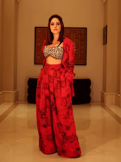 Here's a bold, printed red co-ord set I styled for Nushrratt Bharuccha. The embellished shoulder detail adds a touch of glam, making this a standout look for an evening event.