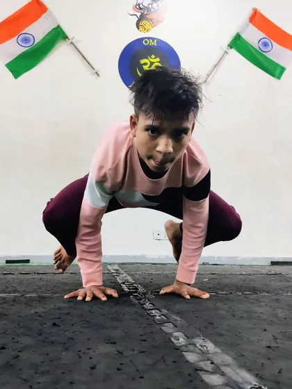 This student shows great strength and balance in a deep squat pose. Yoga is not just about flexibility; it builds a strong and stable foundation.