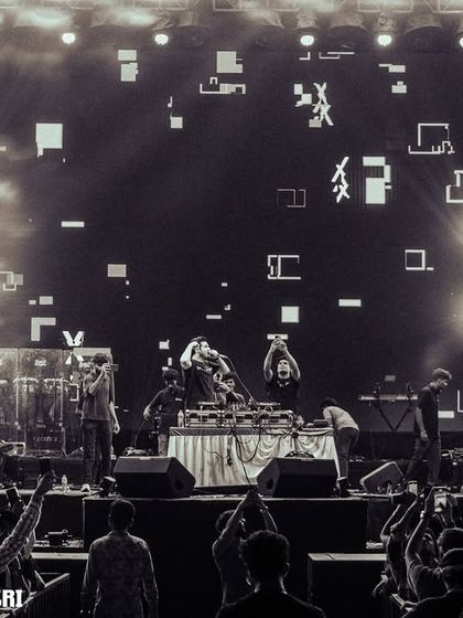 The full scale of the festival production, with stunning visuals and a massive crowd.