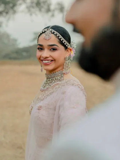 A candid moment of pure happiness. Her makeup is designed to look just as beautiful when she's laughing as when she's posing.