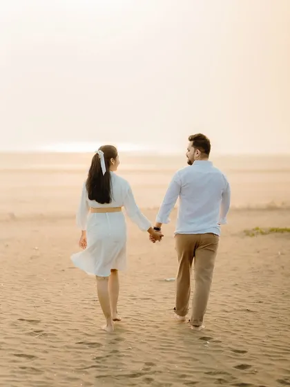 Walking towards the sunset on the beach, this shot of Milan and Pranali symbolizes their journey ahead. The soft, hazy light creates a dreamy and peaceful mood.