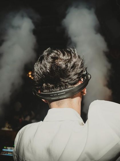 A dramatic shot from behind, with CO2 smoke creating a powerful silhouette. This highlights the theatrical elements I bring to my performances.