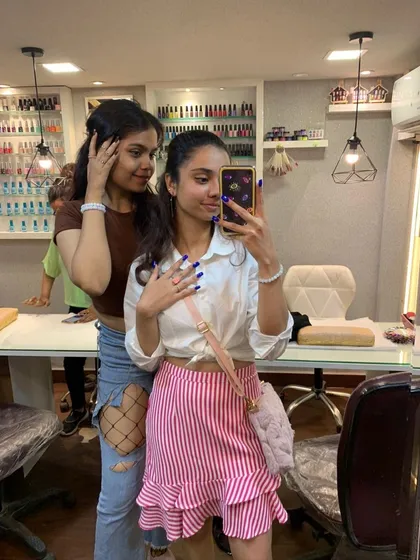 A client taking a cute selfie in my studio mirror after getting her nails done. I love when you feel good enough to capture the moment.