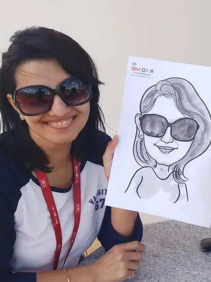 Even with sunglasses on, I can capture a great likeness! This was a fun, quick sketch done at an outdoor corporate event.