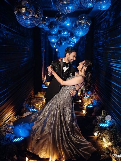 A glamorous couple dancing under a ceiling of disco balls at the Fairmont Jaipur. This image shows how I capture the energy and style of modern, luxurious celebrations.