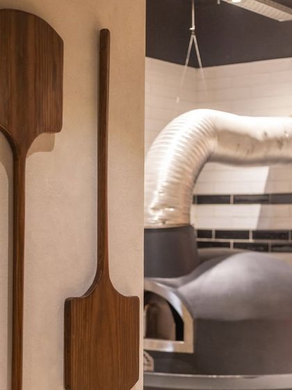 The decor at my events is quaint yet simple, creating a warm and inviting atmosphere. This shows the tools of the trade and the oven itself.