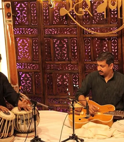 Our baithaks often feature unique instrumental pairings. Here, a tabla and a Hawaiian guitar come together to create a beautiful fusion of sounds, showcasing the versatility of Hindustani classical music.
