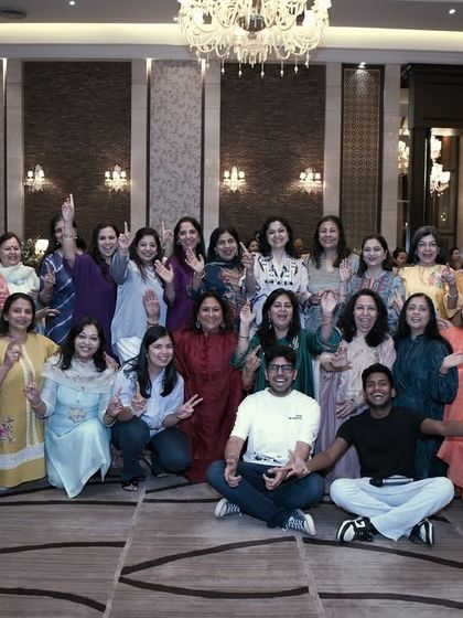 Our team posing with a group of enthusiastic family members during a rehearsal. We make sure our practice sessions are as fun as the final performance.
