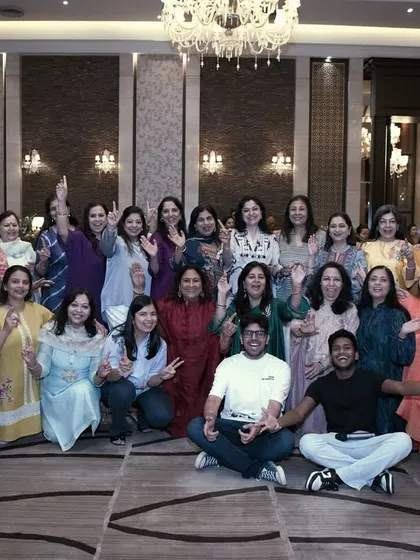 Our team posing with a group of enthusiastic family members during a rehearsal. We make sure our practice sessions are as fun as the final performance.