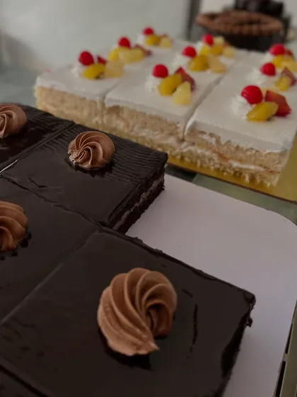 Slices of classic chocolate and fresh fruit pastries, perfect for when you want a smaller treat.