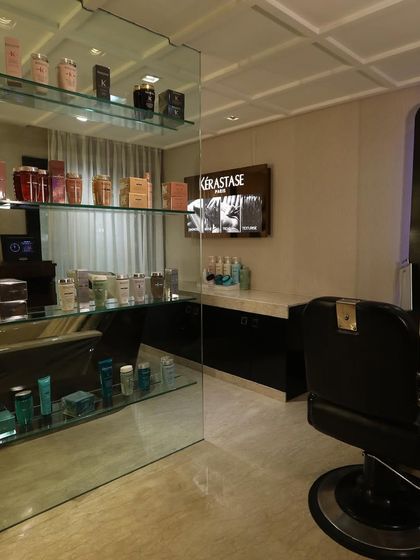 This is one of our dedicated men's grooming stations. It is fully equipped with premium products and tools, set within a space that feels both exclusive and comfortable.