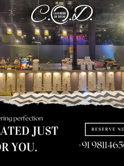 A full view of our buffet setup for an evening event, with hanging lights creating a warm and inviting atmosphere. The long, illuminated counter is meticulously arranged to ensure a smooth flow for guests.