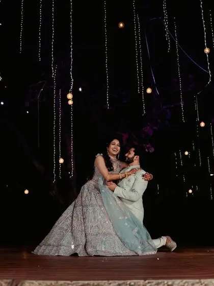 Your first dance as a married couple should be magical. I choreograph romantic and story-driven sangeet performances, complete with stage effects like this, to create a truly unforgettable moment for you and your guests.