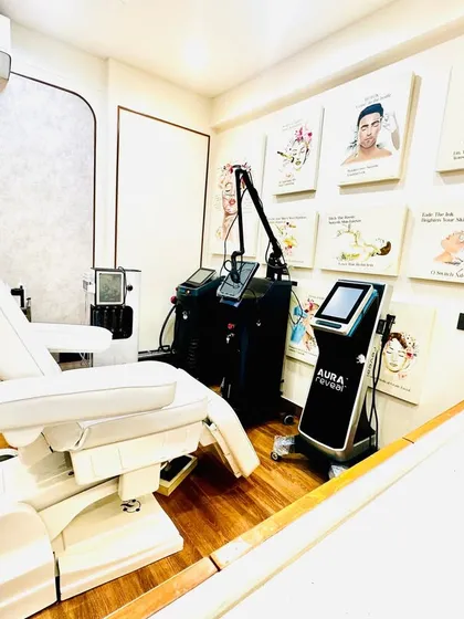 My treatment room is designed for your comfort and equipped with state of the art, US-FDA approved laser machines. I believe in investing in the best technology, like the Aura Toning laser shown here, to deliver superior, reliable results for all skin and hair treatments.