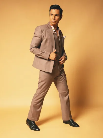 A full-length shot showcasing the complete styling for Randeep Hooda's classic suit. This demonstrates how we build a complete character look for a celebrity photoshoot.