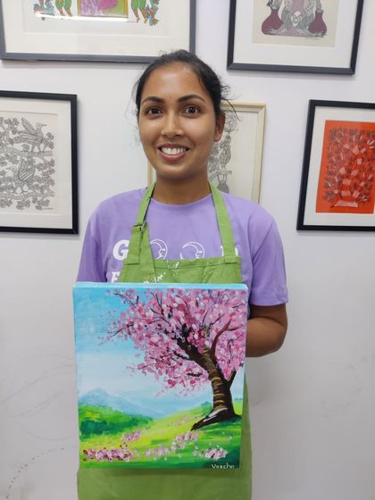 A collection of happy students from our adult canvas painting workshop, each holding their unique and beautiful landscape and abstract creations.