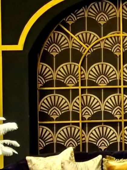 An example of our custom fabrication work, this Art Deco wall panel features a classic black and gold fan pattern. These panels were used to create sophisticated backdrops and partitions throughout the event space.