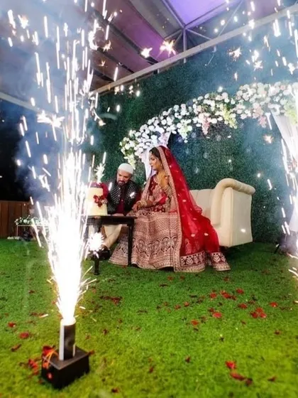 A royal red themed Nikah ceremony, with the couple framed by dramatic cold pyro for a truly memorable moment.