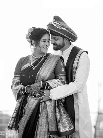 A beautiful black and white portrait of Chaitrali and Parth, highlighting their connection and the elegance of their traditional attire.