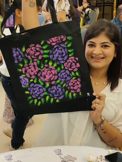 The results of a fabric painting session are always so personal and beautiful. This guest at a baby shower created a stunning floral design on a tote bag. It’s a functional piece of art that serves as a lovely reminder of a special day.