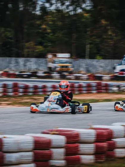 A two-kart battle between teammates during a practice session.