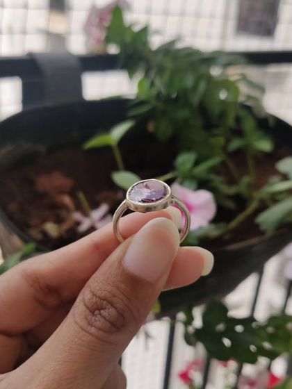 This matching jewelry set, a heart-shaped pendant and a ring, was created using a client's preserved rose petals. It's a beautiful way to keep a sentimental flower close to your heart.