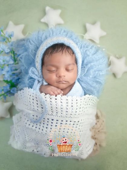 Another perspective of this starry night setup, showing the baby nestled in a cozy white blanket. The different angles provide a lovely variety for your gallery.