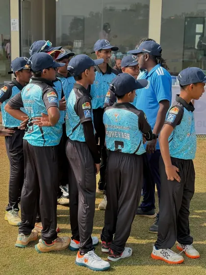 Giving last minute instructions to the U-14 team during the Disha Premier League. Strategy and planning are just as important as skill.
