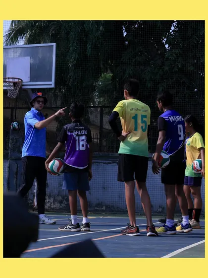 I take a moment to give specific instructions to our U-14 players. Clear communication and individual attention help them understand complex techniques.
