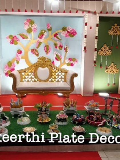 This baby shower setup for 21 plates was done at the Sri Annapoorana Hotel. The tree-of-life backdrop was beautifully complemented by my platter decorations.