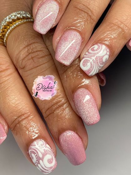 A soft and pretty design with a shimmery pink base and white swirl accents.