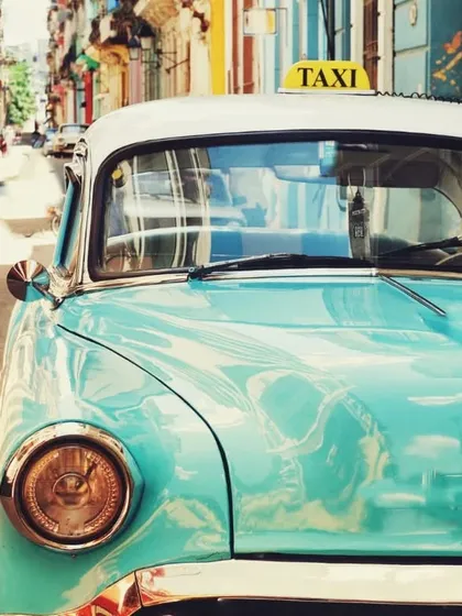 This vintage car in a colorful Cuban street hints at a fascinating part of Flamenco history. I teach my students about the 'Cantes de Ida y Vuelta', styles that traveled from Spain to Latin America and returned, enriched with new rhythms and melodies. It shows how Flamenco is a living, breathing art form with a global story.