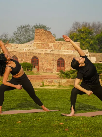 Practicing Utthita Parsvakonasana (Extended Side Angle Pose) outdoors. This pose strengthens the legs, opens the hips, and creates a beautiful line of energy from foot to fingertip.