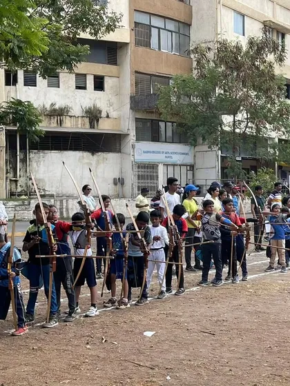 A large group of young archers ready on the shooting line during the Drona Cup. It's fantastic to see such a strong turnout for our academy's event.