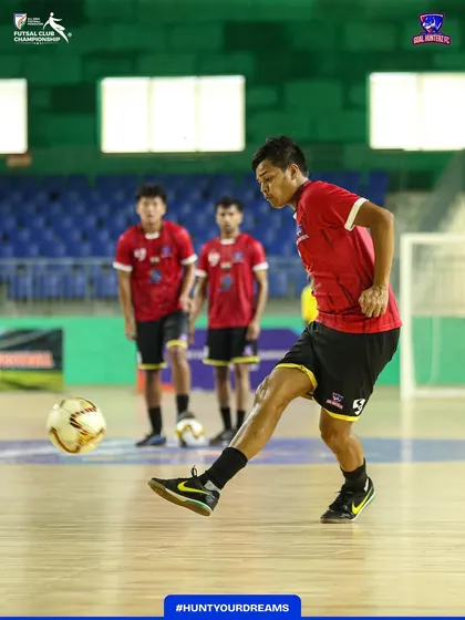 A player practicing his shooting accuracy before the semi-final.