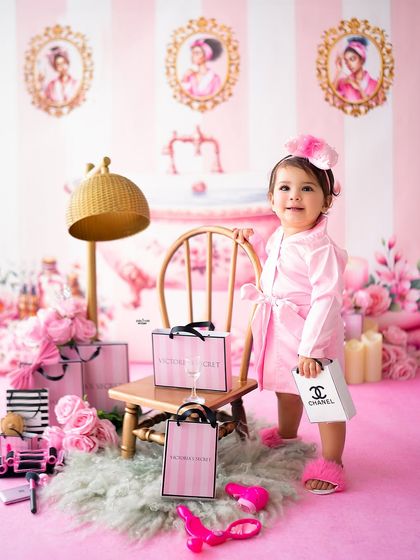 Standing tall with her shopping bags, this little one is ready to shop till she drops.