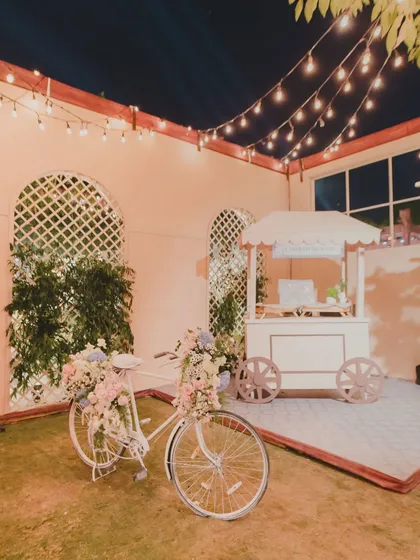 The magic is in the details that tell your story. For a Parisian-themed cocktail night, we created a charming Ladurée pop-up, complete with a floral bicycle, offering guests a sweet, unexpected escape.
