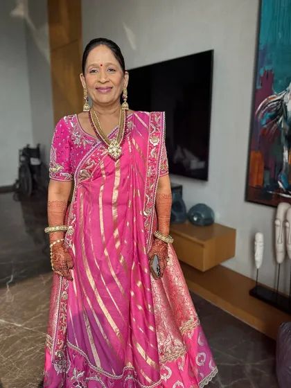 Another beautiful shot of the mother of the bride, exuding elegance and joy. The makeup is tailored to mature skin, providing a smooth, lifted, and glowing finish.