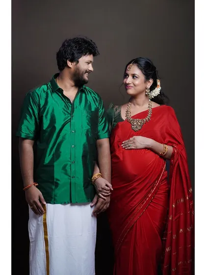 A beautiful studio maternity portrait of a couple in traditional South Indian attire. This image highlights my ability to create timeless, intimate photographs that celebrate the journey to parenthood, focusing on the couple's connection.