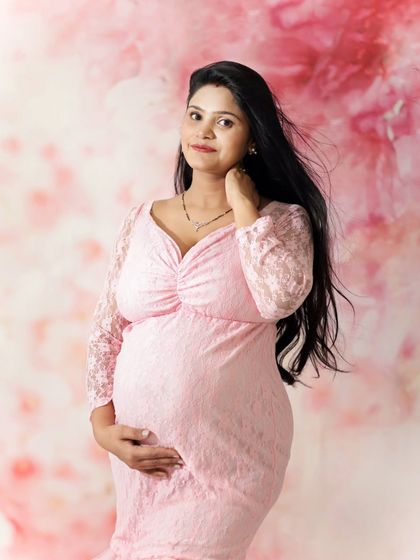 This mother-to-be looks radiant in a pink lace gown against a soft pink backdrop. We did this shoot on an urgent basis, showing we are always ready to capture your memories, no matter what.