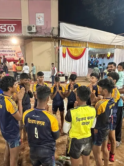A moment of prayer and team unity before a crucial match.