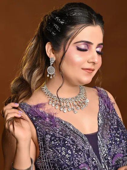 Another shot of the engagement look, showing the elegant neckline of the purple gown.
