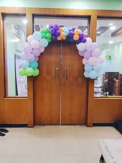 Another view of the simple pastel balloon arch, showing how it can brighten up any entryway for a party.