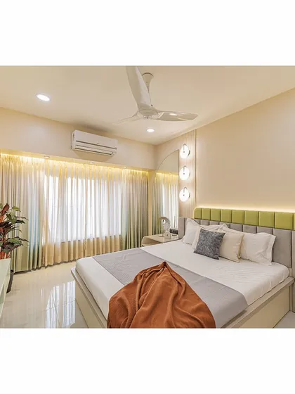 This view showcases the full length of the room, from the bed to the window. The design is clean and uncluttered, maximizing the sense of space and light.