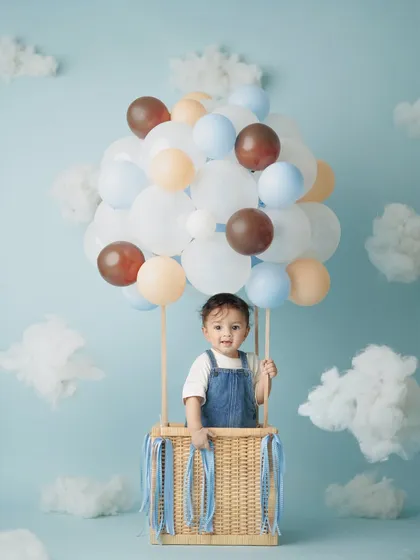 This hot air balloon theme for my son Caden's 8-month milestone was so much fun to create. I love designing unique, playful studio setups for baby photoshoots that capture their budding personalities.